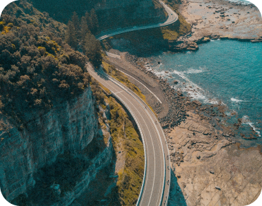 road in the middle of a mountain and the sea mobile